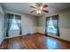 Bedroom with hardwood floors, ceiling fan and window at 3129 Barwell Rd Rd, Raleigh, NC 27610