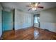 Hardwood floor bedroom with built-in closet and door at 3129 Barwell Rd Rd, Raleigh, NC 27610