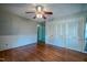 Bedroom with hardwood floor, closet and door at 3129 Barwell Rd Rd, Raleigh, NC 27610