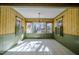 Bright dining room with tiled floor, window views, and floral wallpaper at 3129 Barwell Rd Rd, Raleigh, NC 27610