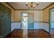 Bright dining room with hardwood floors and access to kitchen at 3129 Barwell Rd Rd, Raleigh, NC 27610