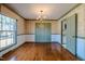 Dining room with hardwood floors and a chandelier at 3129 Barwell Rd Rd, Raleigh, NC 27610