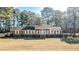 Brick ranch house with a spacious yard and mature trees at 3129 Barwell Rd Rd, Raleigh, NC 27610