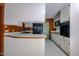 Classic kitchen features wood cabinets, black appliances, and tile flooring at 3129 Barwell Rd Rd, Raleigh, NC 27610