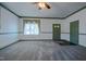Living room with hardwood floors and a ceiling fan at 3129 Barwell Rd Rd, Raleigh, NC 27610