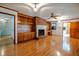 Living room features hardwood floors, brick fireplace, and built-in shelving at 3129 Barwell Rd Rd, Raleigh, NC 27610