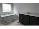 Bathroom with soaking tub and dark vanity at 3284 Roundly Rd # 16, New Hill, NC 27562