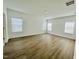 Spacious bedroom with abundant natural light and wood floors, a tranquil retreat at 3284 Roundly Rd # 16, New Hill, NC 27562