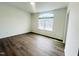 Inviting bedroom featuring hardwood floors and a window providing ample natural light at 3284 Roundly Rd # 16, New Hill, NC 27562