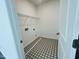 Efficient laundry room features stylish tiled floors and ample space, perfect for your needs at 3284 Roundly Rd # 16, New Hill, NC 27562