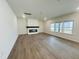 Spacious living room features an electric fireplace and large windows for lots of natural light at 3284 Roundly Rd # 16, New Hill, NC 27562