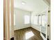 Sunlit office features wood-look flooring, white walls, and multiple windows at 3284 Roundly Rd # 16, New Hill, NC 27562