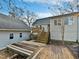Home's back with deck, stairs, and detached garage at 3321 Beech Bluff Ln, Raleigh, NC 27616