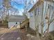 House exterior showcasing a detached garage and wooden deck at 3321 Beech Bluff Ln, Raleigh, NC 27616