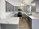 Modern kitchen with gray cabinets and granite countertops at 3321 Beech Bluff Ln, Raleigh, NC 27616