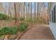 Landscaped side yard with gravel pathway at 3816 Whispering Branch Rd, Raleigh, NC 27613