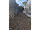 Long narrow backyard with wooden fence and greenhouse at 4053 Little Creek Church Rd, Clayton, NC 27520