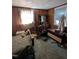 A bedroom with a bed and dresser, showing some clutter at 4053 Little Creek Church Rd, Clayton, NC 27520