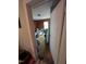 Small bedroom with wood paneled walls and carpeted floors at 4053 Little Creek Church Rd, Clayton, NC 27520