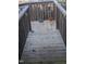Wooden deck with railing, potted plants, and garden statue at 4053 Little Creek Church Rd, Clayton, NC 27520
