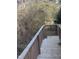 Wooden deck with railing overlooking a wooded area at 4053 Little Creek Church Rd, Clayton, NC 27520