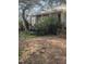 White house with a covered porch and overgrown yard at 4053 Little Creek Church Rd, Clayton, NC 27520