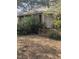 White house with a covered porch and overgrown yard at 4053 Little Creek Church Rd, Clayton, NC 27520