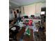 A messy kitchen with a dining table and chairs at 4053 Little Creek Church Rd, Clayton, NC 27520