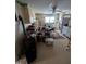 A messy kitchen with a dining area and appliances at 4053 Little Creek Church Rd, Clayton, NC 27520