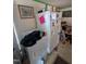 A cluttered laundry room with washer and dryer at 4053 Little Creek Church Rd, Clayton, NC 27520