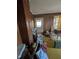 Living room with wood paneled walls and carpeted floors at 4053 Little Creek Church Rd, Clayton, NC 27520