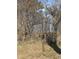 Metal storage shed surrounded by trees and bushes at 4053 Little Creek Church Rd, Clayton, NC 27520