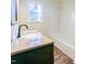 Clean bathroom with updated vanity and bathtub at 509 Mullins St, Rocky Mount, NC 27803