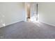 Spacious bedroom with neutral carpet and an open doorway at 509 Mullins St, Rocky Mount, NC 27803