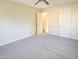 Bright bedroom with neutral carpet and an open doorway at 509 Mullins St, Rocky Mount, NC 27803