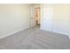Bright bedroom with neutral carpeting and ample closet space at 509 Mullins St, Rocky Mount, NC 27803