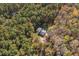 House nestled in a wooded lot at 6328 Bissette Rd, Wendell, NC 27591