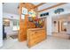 Home bar with wood shelving and a granite countertop at 6328 Bissette Rd, Wendell, NC 27591