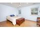 Cozy bedroom with a queen-size bed and cork flooring at 6328 Bissette Rd, Wendell, NC 27591
