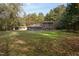 Back of house, showcasing large grassy yard at 6328 Bissette Rd, Wendell, NC 27591