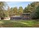 House exterior showcasing large backyard and deck at 6328 Bissette Rd, Wendell, NC 27591