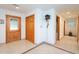 Bright hallway with tile floors and wooden doors at 6328 Bissette Rd, Wendell, NC 27591
