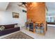 Relaxing living area with a brown couch and built-in shelving at 6328 Bissette Rd, Wendell, NC 27591