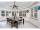 Sunroom boasts a granite table, ceiling fan, and ample natural light at 6328 Bissette Rd, Wendell, NC 27591