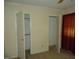 Simple bedroom with two closets and neutral colored carpet at 6369 New Market Way, Raleigh, NC 27615