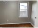 Bedroom with hardwood floors and a window at 7317 Bentley Wood Ln, Raleigh, NC 27616