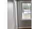 Bedroom featuring hardwood floors and a window with backyard view at 7317 Bentley Wood Ln, Raleigh, NC 27616