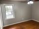 Bedroom with hardwood floors and backyard view at 7317 Bentley Wood Ln, Raleigh, NC 27616