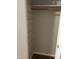 Simple closet with shelves and hanging rod at 7317 Bentley Wood Ln, Raleigh, NC 27616