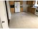 Spacious kitchen featuring wood cabinets, white appliances, and tile flooring at 7317 Bentley Wood Ln, Raleigh, NC 27616